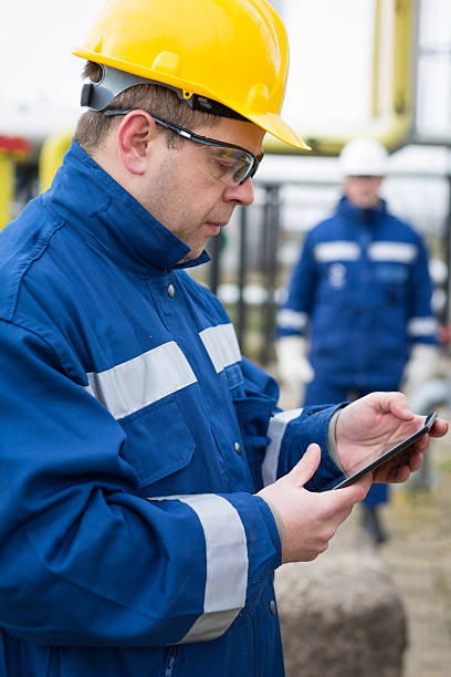 istock Chemical engineers inside oil refinery 471740644