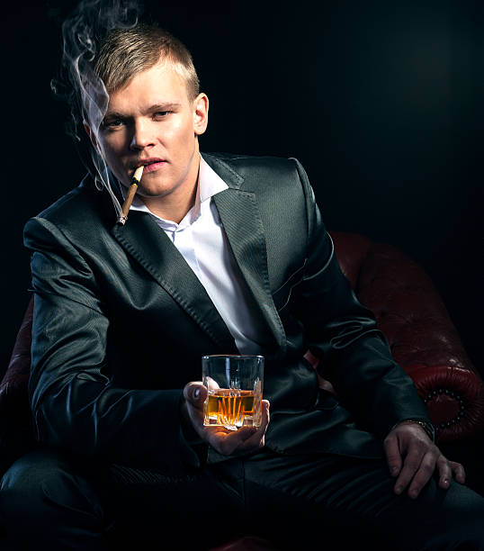istock Mafia boss in the red chair. dramatic lighting 471740803