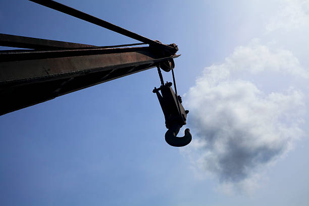 Chasing clouds with a hook Chasing clouds with a crane hook, view from below. j hook stock pictures, royalty-free photos & images