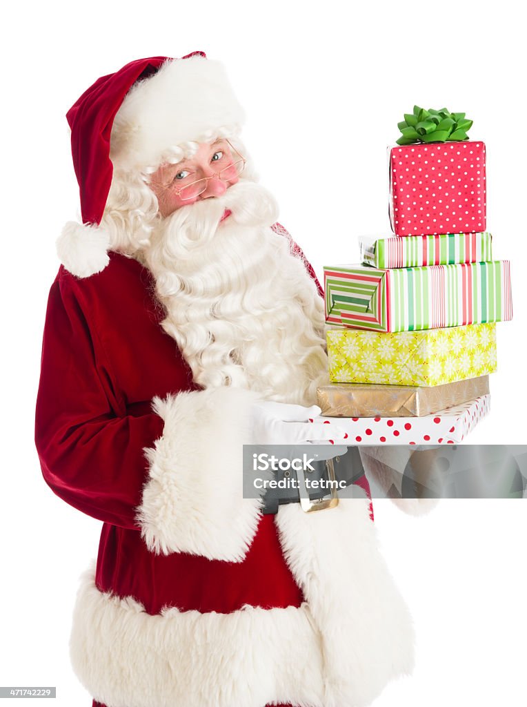 Papai Noel segurando pilha de caixas de presente - Foto de stock de 60 Anos royalty-free