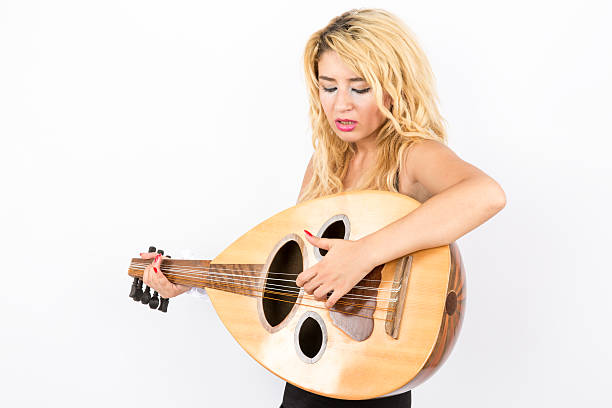 istock woman playing the lute 471743595