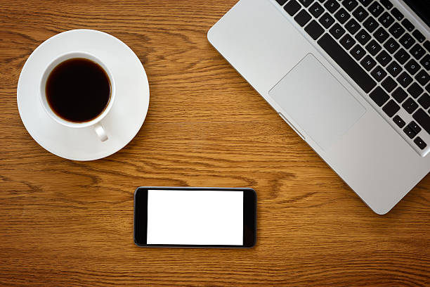 istock Blank white screen smartphone on business desk 471744448