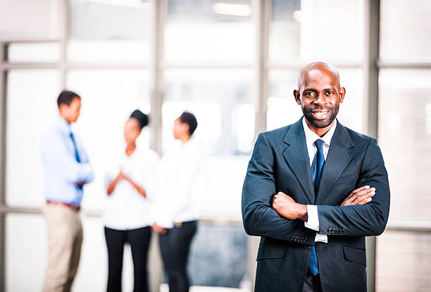 istock Happy businessman with colleagues 471745471