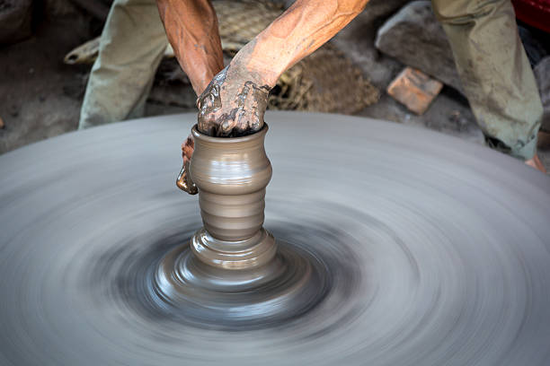 Man artist making pottery in Nepal