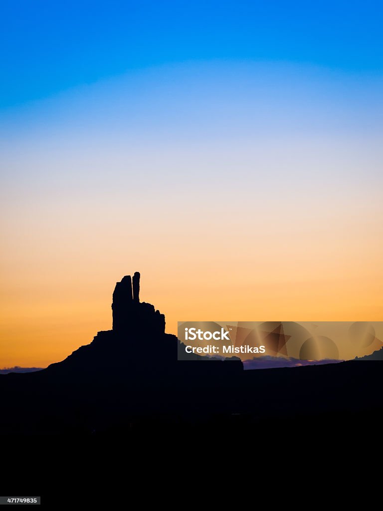 Fingers Crossed Early morning  view towards the Finger Rock rock formation in Monument Valley on the Utah and Arizona border at dawn. Arid Climate Stock Photo