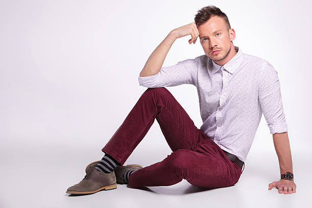 istock casual man posing on the floor 471751229