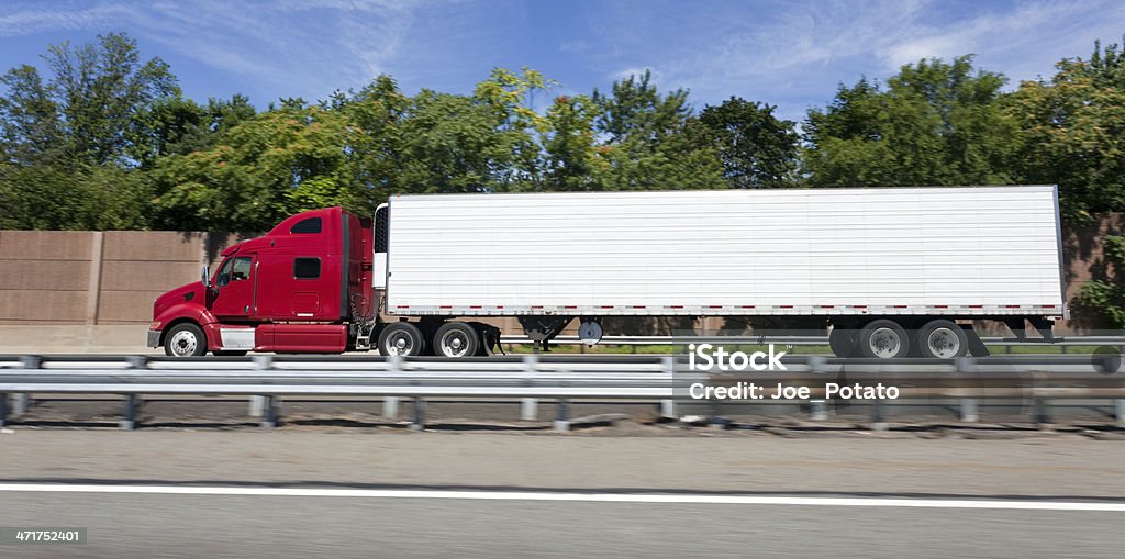 Interstate Trucking Red semi cab and trailer on the New Jersey Turnpike. Horizontal. Truck Stock Photo