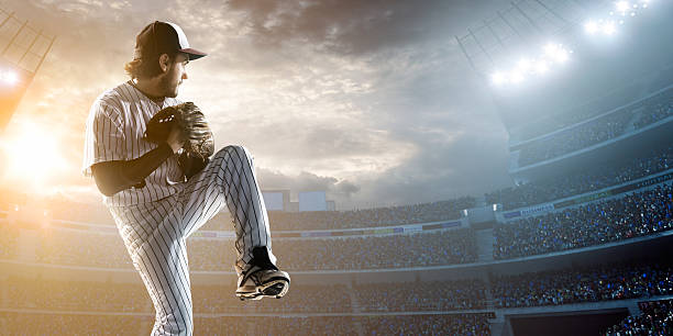 istock Baseball player throwing a ball in stadium 471752870