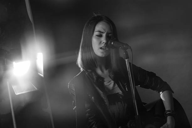 istock the girl playing guitar in the Studio 471753266