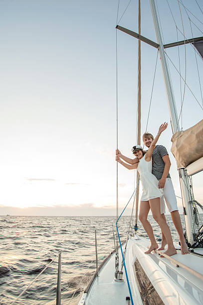 istock Happy young couple relaxing on a yacht 471754897