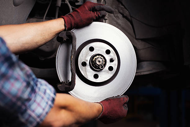 istock Car mechanic Repairing brakes 471755157