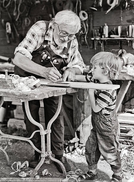 istock Grandfather and grandson in workshop 471756393