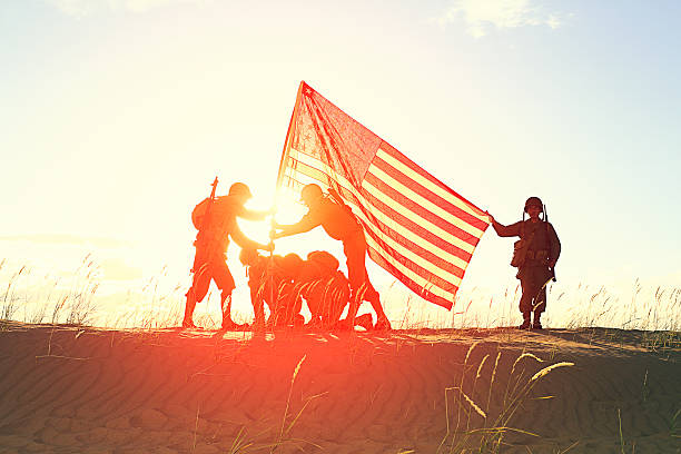 istock World War 2 Soldiers with American Flag 471758865