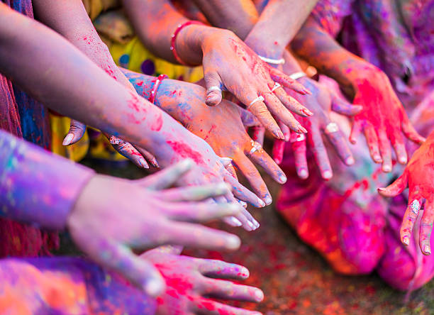 istock hands of Holi 471759612
