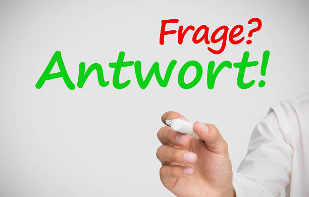 istock Hand writing frage and antwort with a marker 471760657