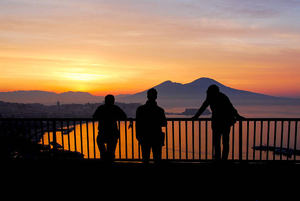 Three friends watching the sun come up over the Bay of Naples and Mt. Vesuvius.