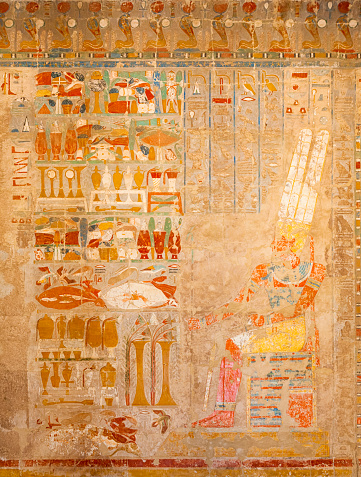 Hieroglyphs on Egyptian funerary stela of Hatshepsut Temple. Falcon-headed Horus und Pharao. Reliefs of the campaigns of Hatshepsut