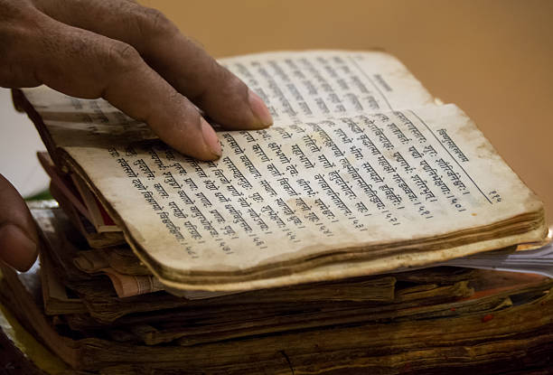 istock Reading old Hindu literature 471762160