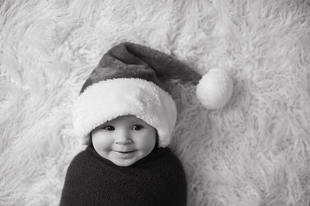 istock Cute Laughing Baby Wearing Santa Hat 471763931