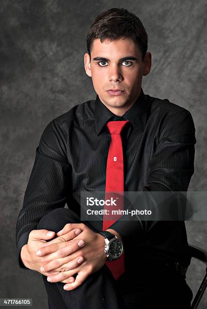 Young Man In Black Shirt With Red Tie Sitting Stock Photo - Download Image  Now - 20-29 Years, Adult, Beautiful People - Istock