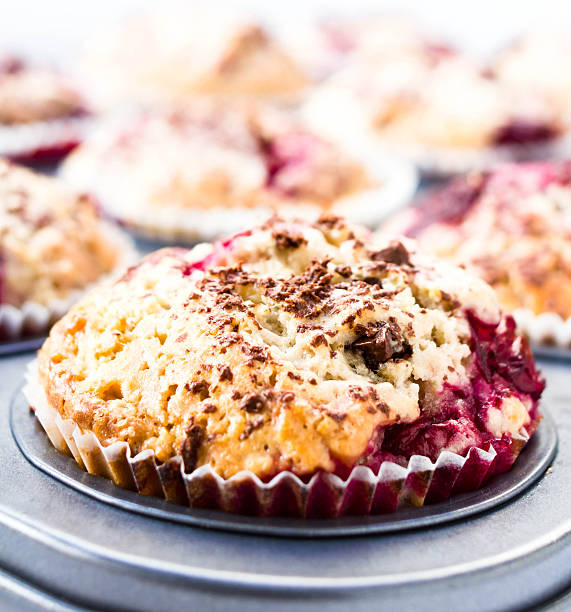 istock Festive chocolate small cakes with cherry  in baking tray. Close 471766459