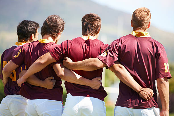 Working together as a team The back view angle of a rugby teamhttp://195.154.178.81/DATA/i_collage/pi/shoots/781664.jpg national anthem stock pictures, royalty-free photos & images