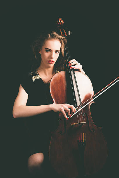 istock Lady Playing a Song on Cello, Looking at Camera 471767112