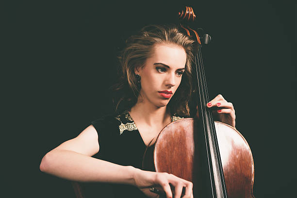 istock Pretty young female musician 471767120