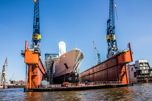 hamburg, germany - April 19, 2015: A big big private yacht is lying in the drydock, in the harbor of Hamburg, Germany.