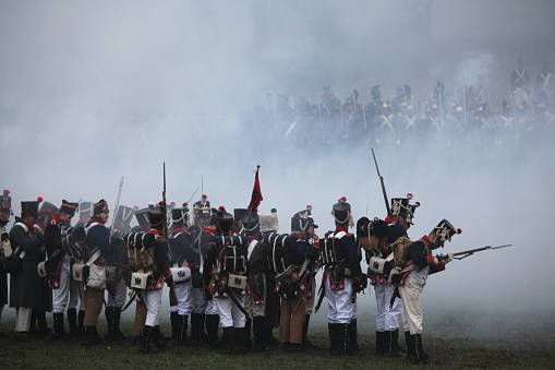 Tvarozna, Czech Republic - December 3, 2011: Re-enactors uniformed as French soldiers attend the re-enactment of the Battle of Austerlitz (1805) near Tvarozna, Czech Republic.