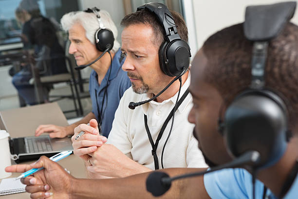 istock Sports commentators watching football game from press box 471769269