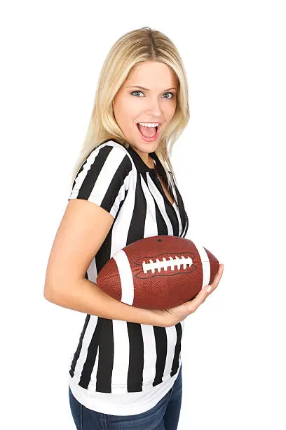 beautiful woman in referee shirt holding football
