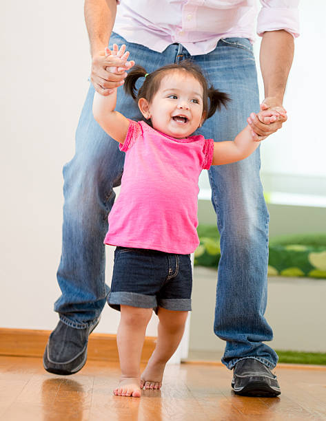 istock Baby girl starting to walk 471771812