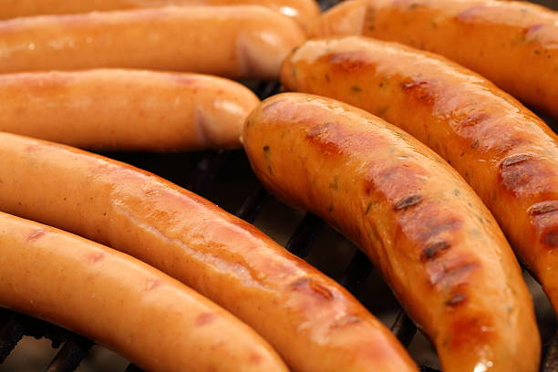 istock Sausages on a barbecue grill 471772367
