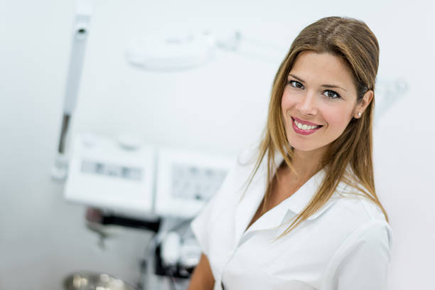 Female dermatologist working at a spa and using dermabrasion machines