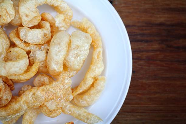 istock Fried Pork Skin on wood 471773453