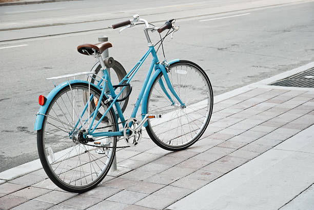 istock Women's bicycle parked on the street 471773527