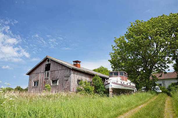 Abandoned farm with boat stock photo