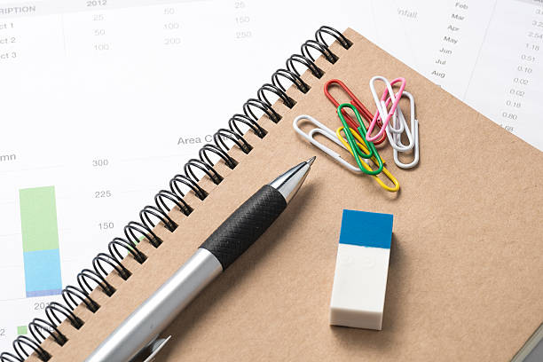 istock business and financial report with pen.Document is mockup 471776560