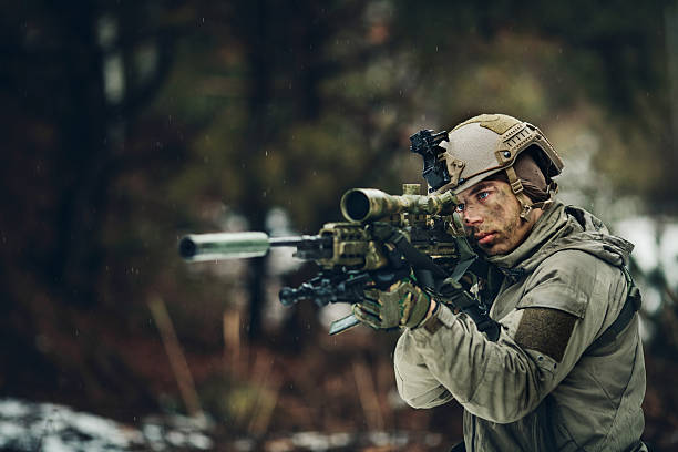 istock armed  man in camouflage with sniper gun 471776968