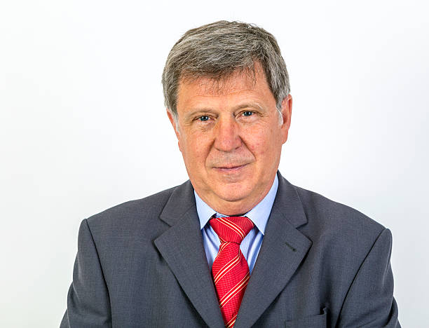 istock smiling mature businessman standing 471776980