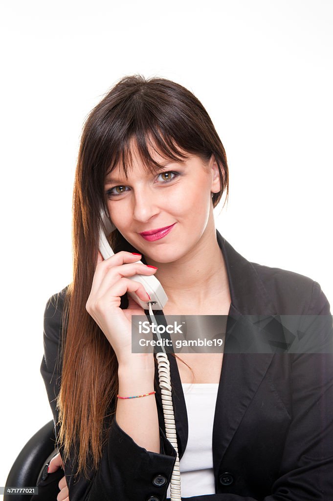 Giovane donna d'affari di parlare al telefono su sfondo bianco - Foto stock royalty-free di Adulto