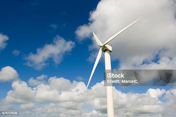 Wind Turbine Against The Cloudy Sky Stock Photo - Download Image Now - Business Finance and Industry, Choice, Clean