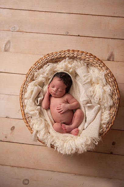 istock African American Baby Sleeping Peacefully in Basket 471777539