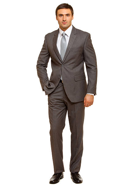 istock Well-dressed man. Charismatic businessman standing on white background 471778522