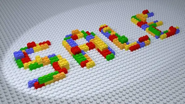 SALE Wording Built from Colorful Plastic Bricks on White Baseplate
