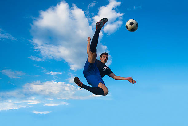 istock Side volley kick against the blue sky 471780293