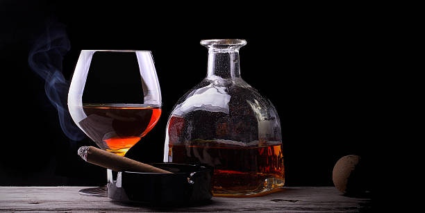 istock Cognac glass shrouded in a smoke 471781067
