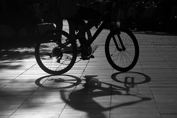 A bicyclist  on the street.