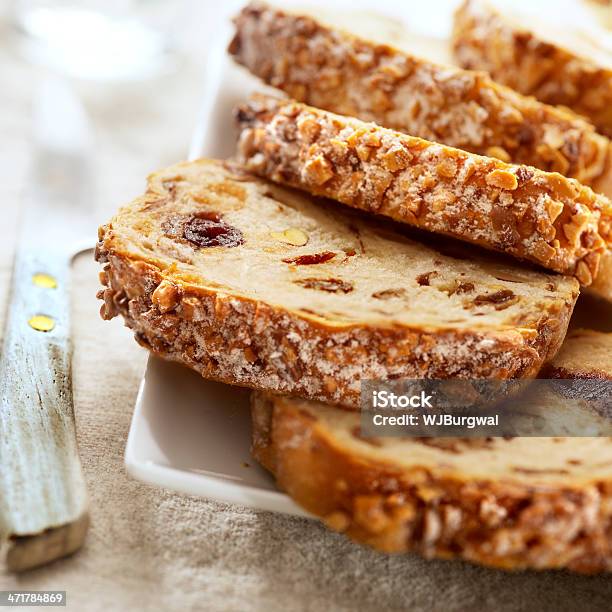 Slices Of Fruit Bread On A Plate With A Knife Stock Photo - Download Image Now - Baked, Bakery, Bread